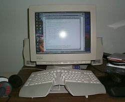 Monitor, speakers, and funky keyboard